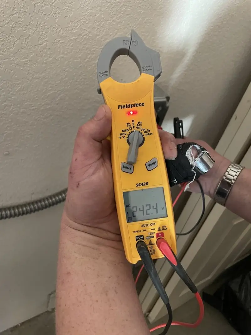 Voltage testing with clamp meter during Electrical Installation Services in Lexington